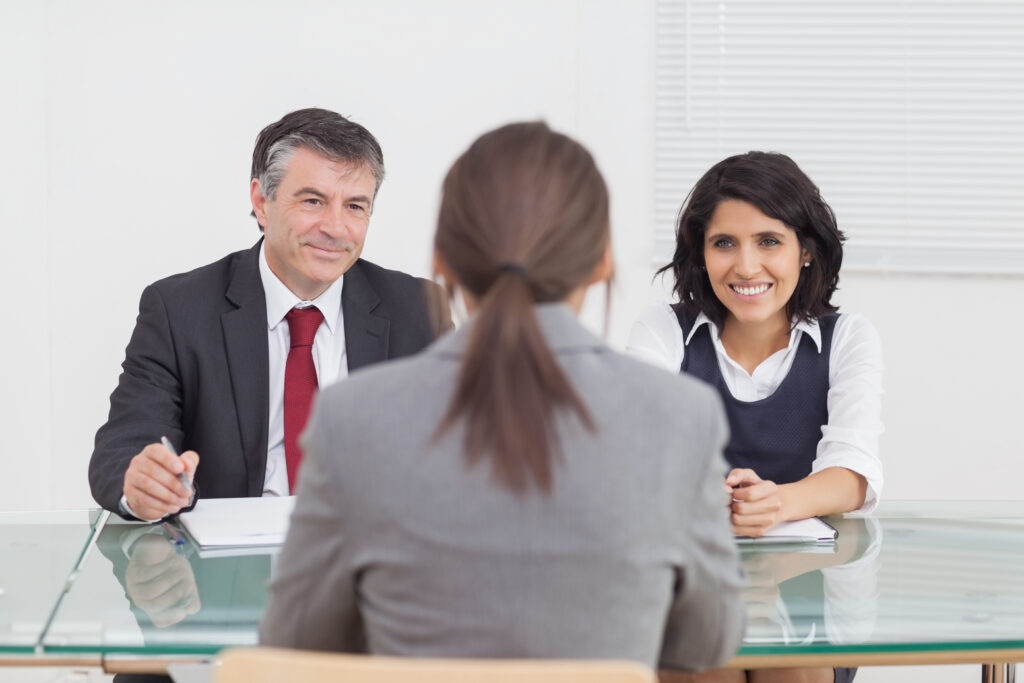 Business People Talking And Smiling In A Small Meeting In Office