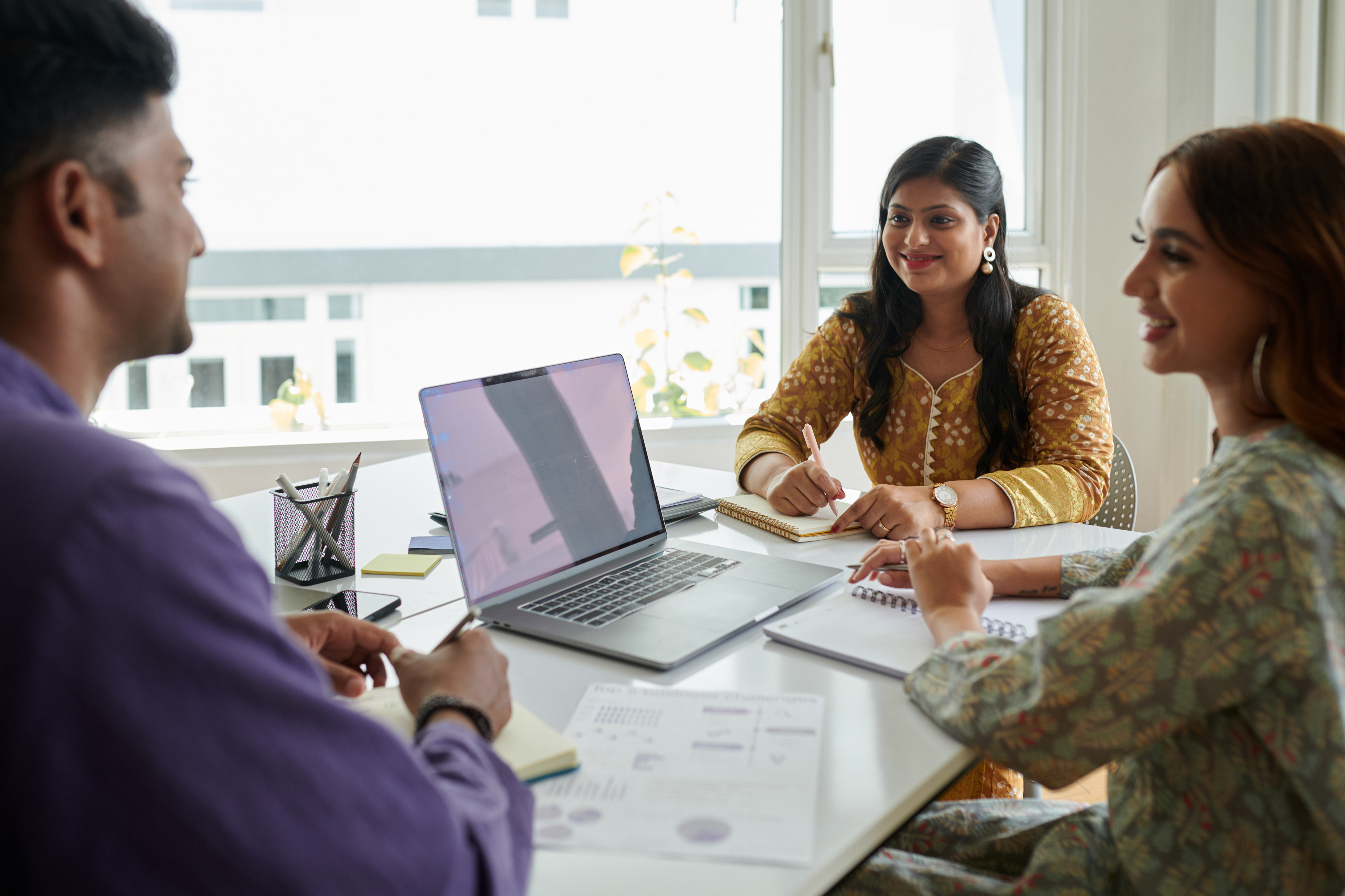 Businessman Presenting Ideas To Coworkers